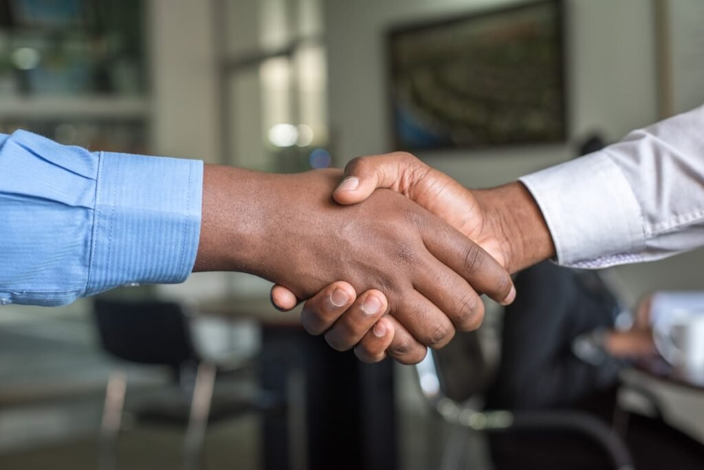 Handshake between a Dover Junk crew member and a happy customer after a junk removal job